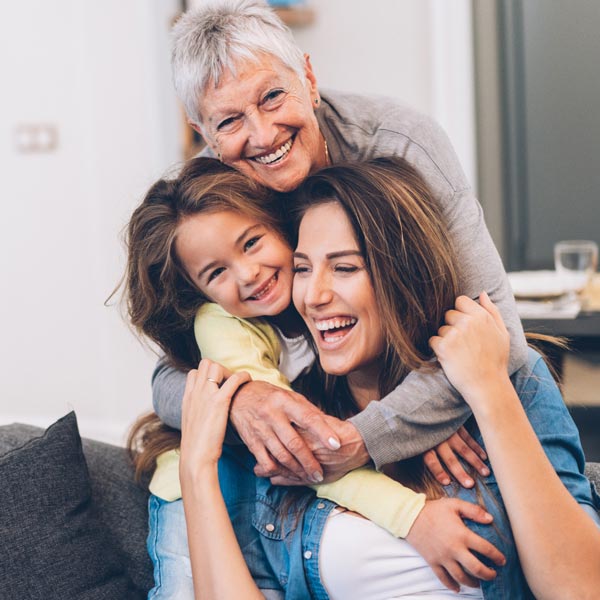 family smiling hugging and cuddling